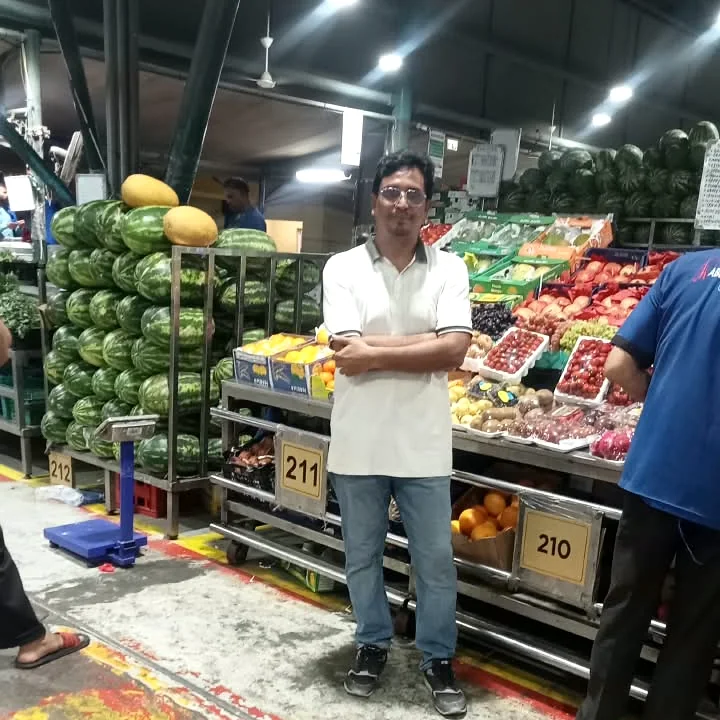 Sayed Hasan at a watermelon and fruit stall in Al Aweer Market